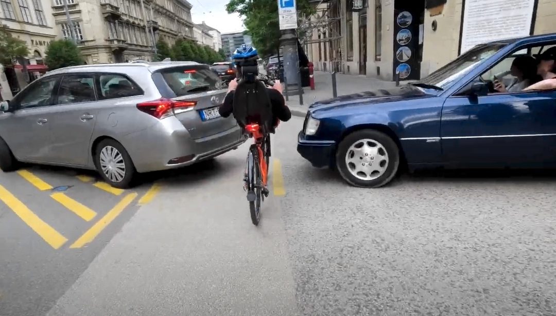 race of recumbent bike and a car in the city traffic