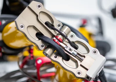 Oversize precisely machined, smoothly operated folding mechanism with the internal routing of cables.